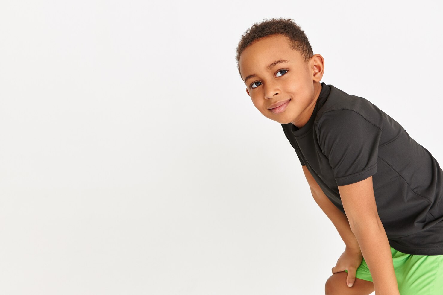 adorable-little-boy-black-t-shirt-green-shorts-resting-cardio-workout-keeping-hands-his-knees_343059-1135